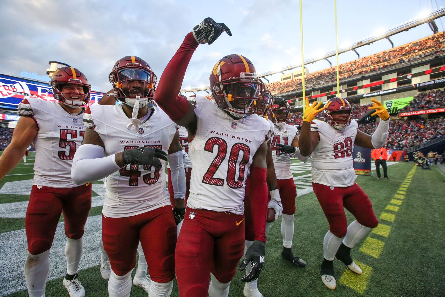 Washington Commanders cornerback Jartavius Martin (20) celebrates after an interception during the second half against the New England Patriots at Gillette Stadium.
